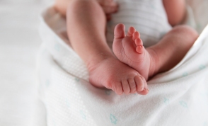 Close up of newborn baby feet. Baby details.